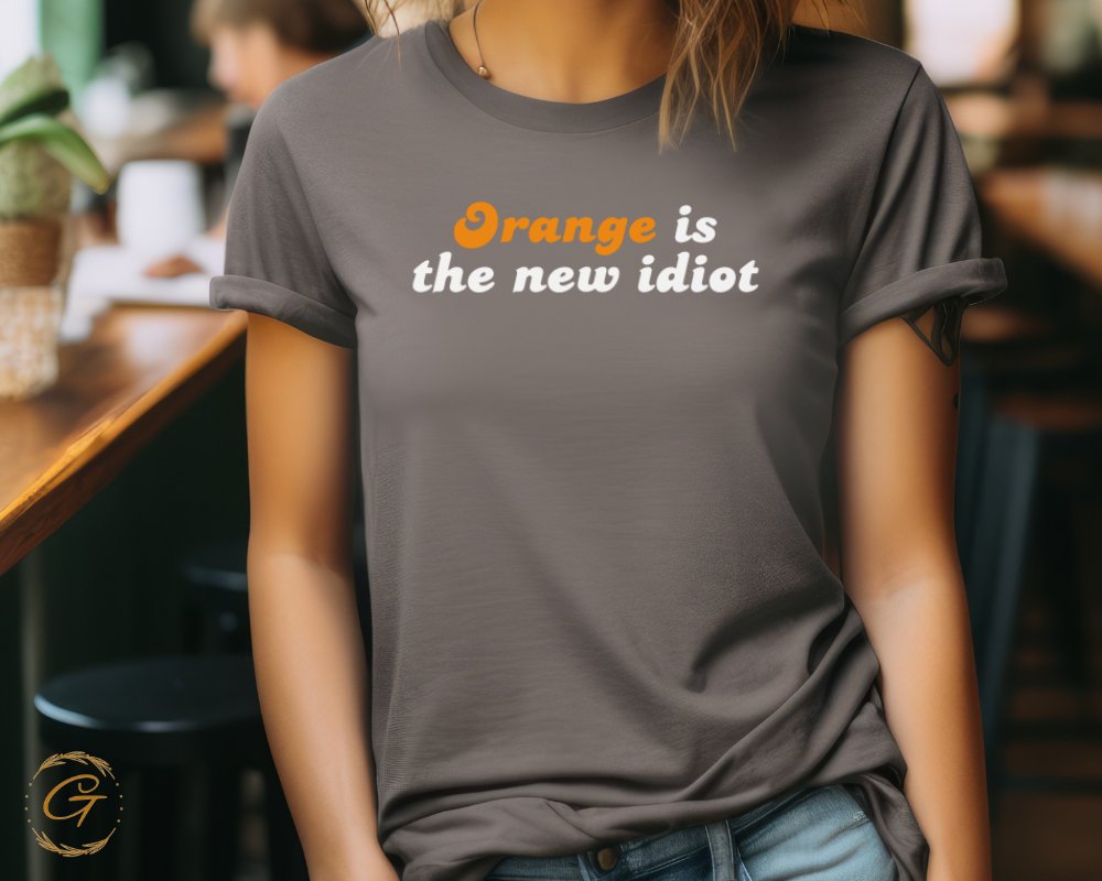 Orange is the new idiot graphic t-shirt product